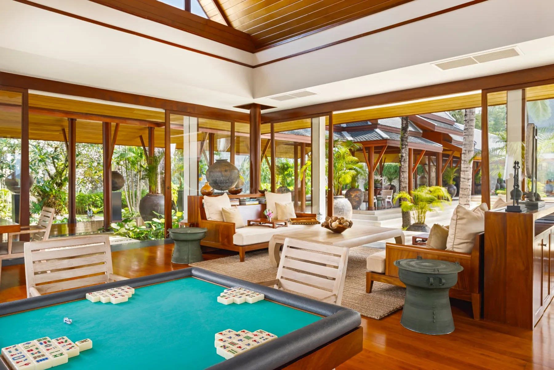 Library sala games room with mahjong table and garden views