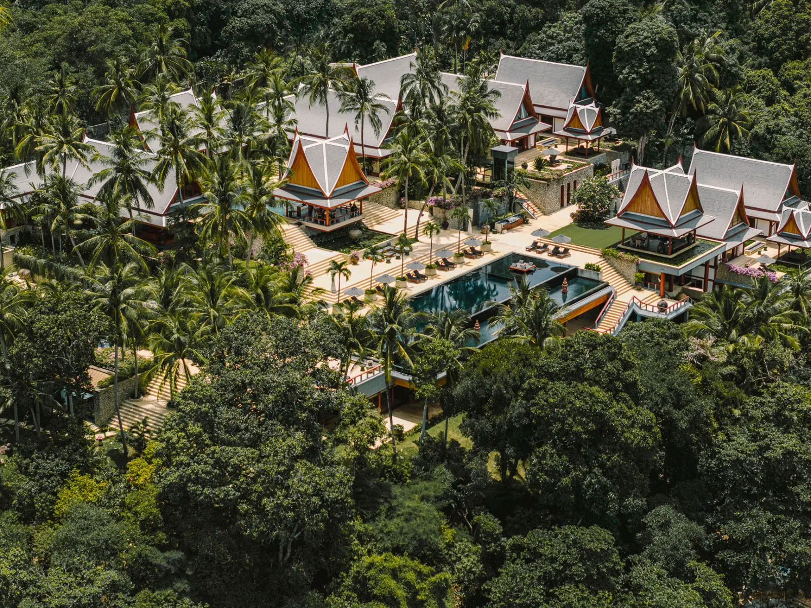 Aerial view of luxury villa rental Phuket at Chandara Estate, private oceanfront pavilions and infinity pool