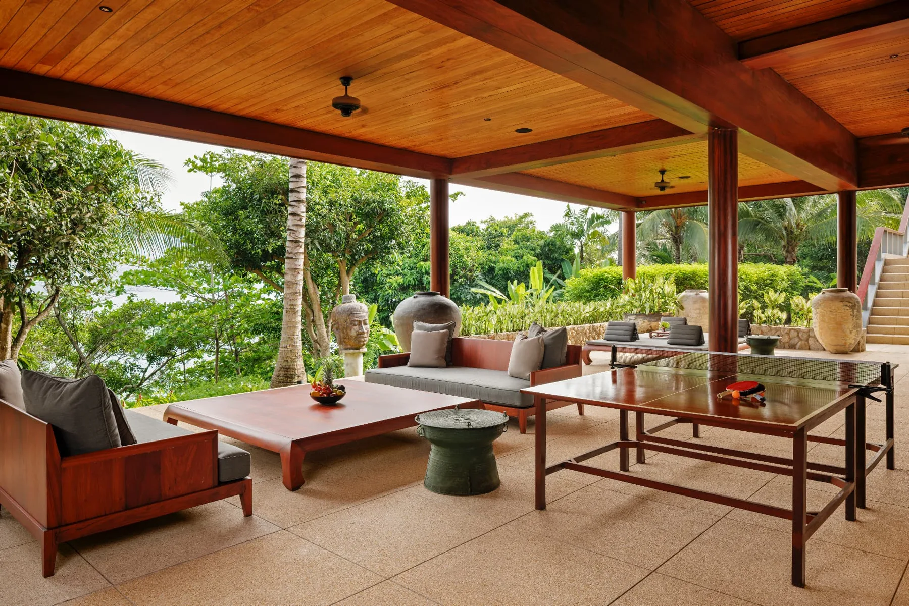 Covered terrace lounge with table tennis overlooking the sea